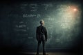 Scientist in front of a blackboard with equations and problem solving solutions. Generative Ai