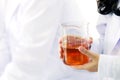 Scientist Fuel Test. Chemist scientific testing quarity of the oil. Red Chemistry Test. Glass Laboratory Science on Women`s Hand Royalty Free Stock Photo