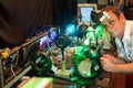 Scientist with glass demonstrate laser Royalty Free Stock Photo