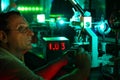 Scientist with glass demonstrate laser Royalty Free Stock Photo