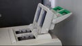 Scientist with gloved hand putting DNA sample into real-time PCR-cycler