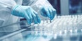 Scientist with gloves checking medical vials at laboratory