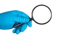 Scientist hand in blue glove holding magnifier isolated on white Royalty Free Stock Photo