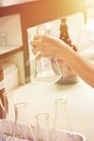 Scientist hand catch a Clean laboratory glassware Chemical flask