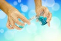 Scientist hand pouring blue liquid