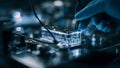 Scientist Handling Microfluidic Device in Laboratory Royalty Free Stock Photo