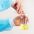 Scientist hands is conducting chemical experiments in laboratory