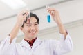 Scientist happy to successful discover new drug formula by choice select good chemical liquid in medical science lab Royalty Free Stock Photo