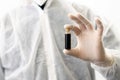 Scientist holding bottle of vaccine developed for corona virus. Covid-19 antidote. Doctor discovers treatment for epidemic disease Royalty Free Stock Photo