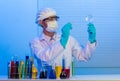 Scientist holding pen with magnifying glass