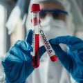 scientist holding plastic tube with covid-19 or coronavirus label Royalty Free Stock Photo