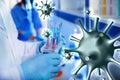 Scientist holding test tubes with liquids in laboratory