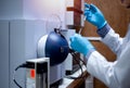 Scientist inject sample with micro syringe to Mass Spectrometer for analysis Royalty Free Stock Photo