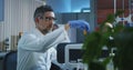 Scientist loading vials into a testing machine