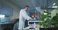 Scientist loading vials into a testing machine