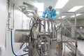 Scientist look in steel tank in laboratory Royalty Free Stock Photo