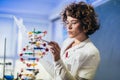 Scientist looking at DNA in laboratory Royalty Free Stock Photo