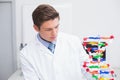 Scientist looking at dna model Royalty Free Stock Photo