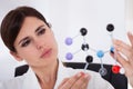 Scientist looking at dna molecular structure Royalty Free Stock Photo