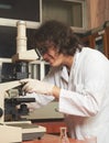 Scientist looking microscope Royalty Free Stock Photo