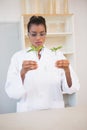 Scientist looking at sprouts in test tube Royalty Free Stock Photo