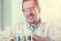 Scientist looking at test tubes with chemicals Royalty Free Stock Photo