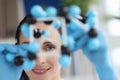 Scientist looks at model of mockup made of molecules closeup