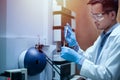 Scientist man analyzing a sample using the high-performance analytical instrument, TOF Mass spectrometer for drug development in Royalty Free Stock Photo