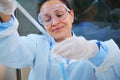 Scientist medical biologist using pipette, drips reagent into test tube, conducts clinical research works on new vaccine Royalty Free Stock Photo