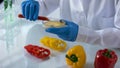 Scientist mixing liquids petri dish examining pepper, toxicology food studies