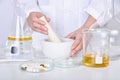 Scientist mixing vitamin supplement, Pills and scientific laboratory glassware, Medicine research and development concept Royalty Free Stock Photo