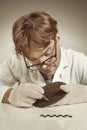 Archaeologist researcher taking samples of cuneiform material Royalty Free Stock Photo