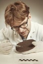 Archaeologist researcher taking samples of cuneiform material Royalty Free Stock Photo