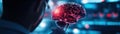 A scientist observes a glowing, intricate brain model, symbolizing advanced neuroscience research and technology