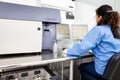 Scientist performing a flow cytometric analysis in the laboratory. Flow cytometer Royalty Free Stock Photo