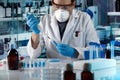 Scientist pipetting tube test in the research laboratory