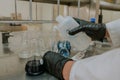 Scientist preparing solutions and analyzing the results of chemical reactions in his laboratory