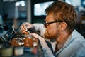 Scientist prototyping electrical device in lab