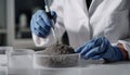 Scientist pulverizing and sieving soil samples at table, closeup. Laboratory analysis Royalty Free Stock Photo