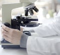 Scientist researcher using microscope in laboratory. Medical healthcare technology and pharmaceutical research. Royalty Free Stock Photo