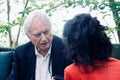 Scientist Richard Dawkins talking to a woman during the conference about Dissent in Koln, Germany