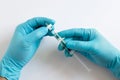 Scientist's hands attaching a syringe filter to a syringe for sample preparation Royalty Free Stock Photo