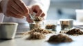 A scientist's hands carefully crushing and sifting a dry soil sample for lab analysis Royalty Free Stock Photo