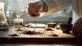A scientist's hands carefully crushing and sifting a dry soil sample for lab analysis Royalty Free Stock Photo