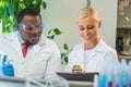 Scientist and students working in lab. Doctor teaching interns to make blood analyzing research. Coronavirus, chemistry Royalty Free Stock Photo