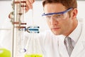 Scientist Studying Liquid In Flask Royalty Free Stock Photo
