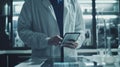 Scientist with Tablet in Laboratory.AI generated image Royalty Free Stock Photo