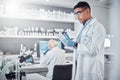 Scientist, tablet and research innovation in laboratory for medical analytics, science development or biotech