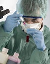 Scientist taking a probe in a labor scene with tes Royalty Free Stock Photo