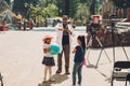 Scientist teaching children with scaled planets the movement and function of an eclipse. Royalty Free Stock Photo